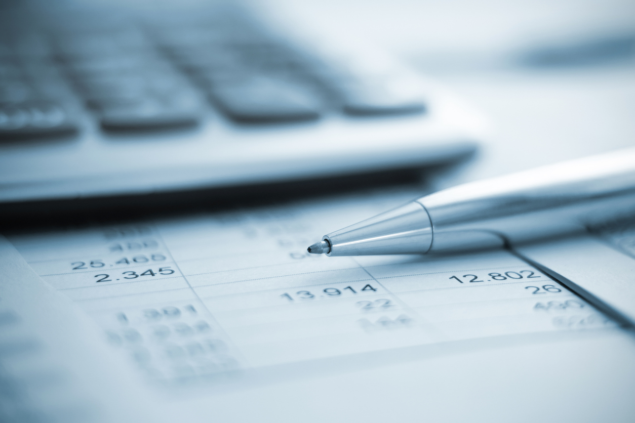 Pen resting on balance sheet