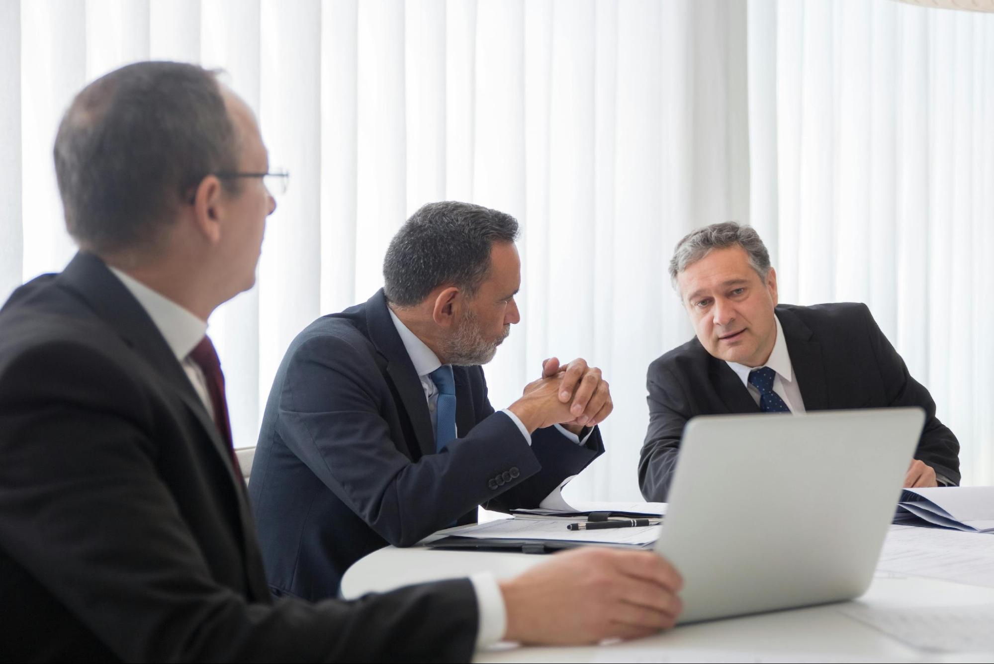 Men in a business meeting discussing accountant negligence