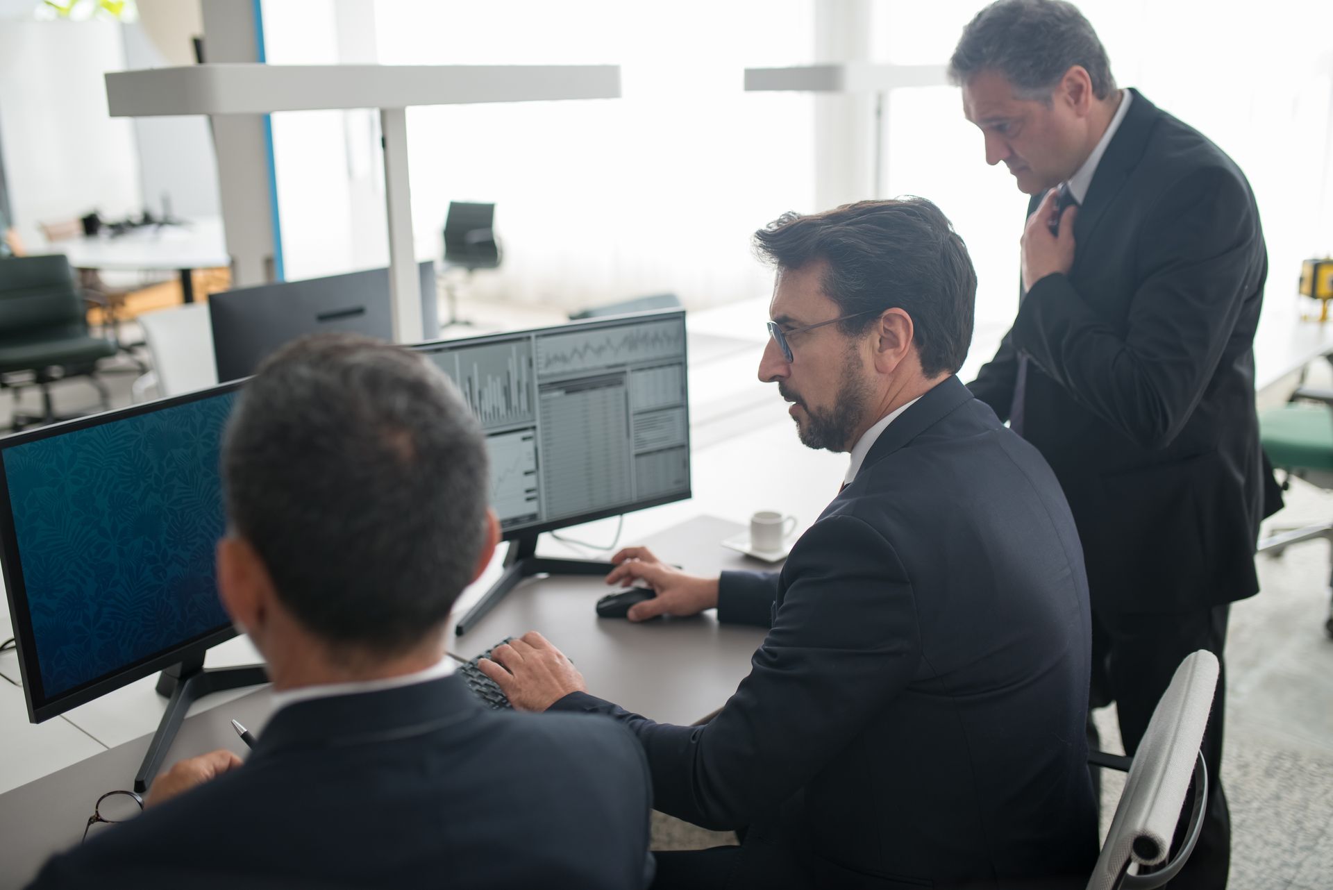 Men in a meeting discussing commercial fraud